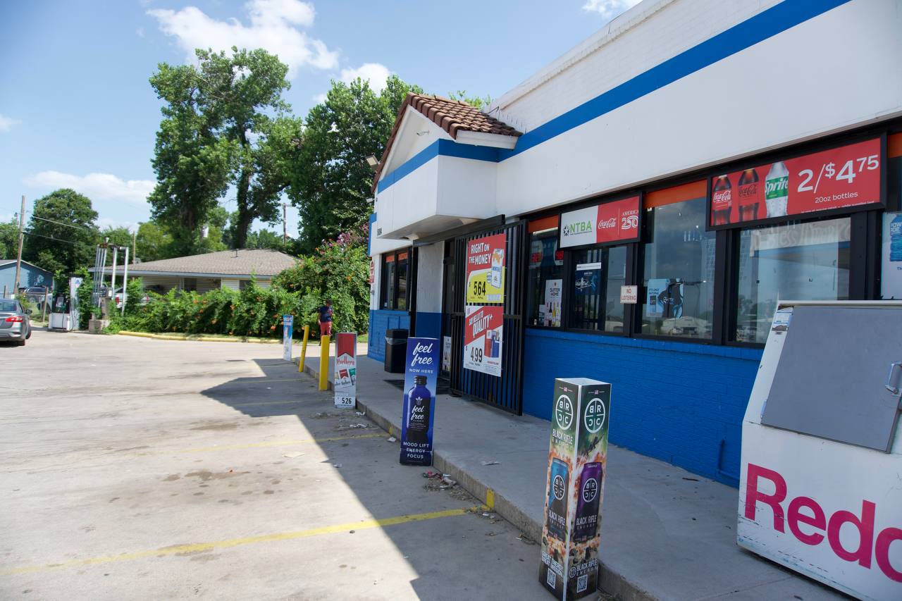 Gas station convenience store with Redbox kiosk in the foreground